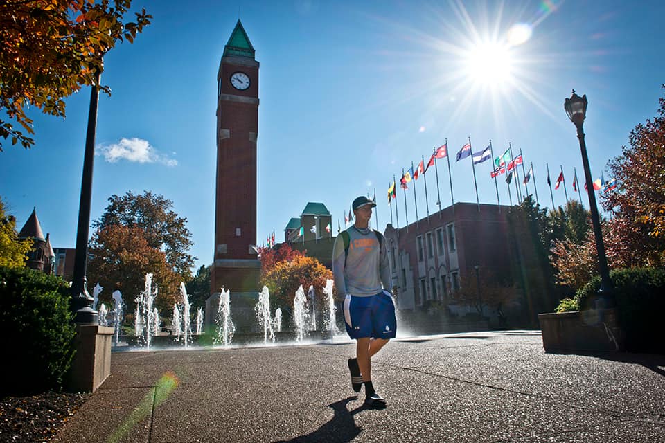 Student walks across campus