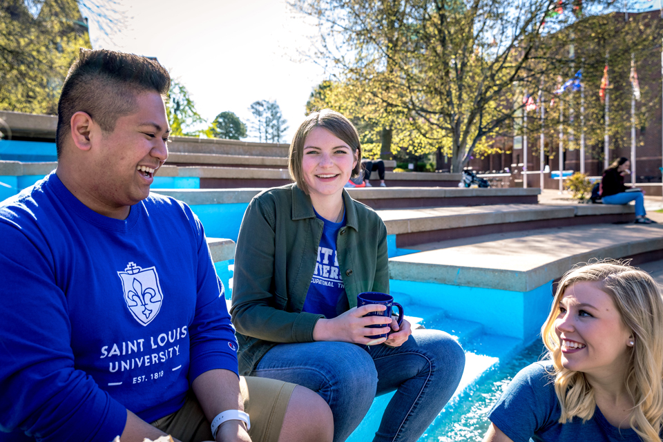 Students at clock tower for Java with the Jesuits