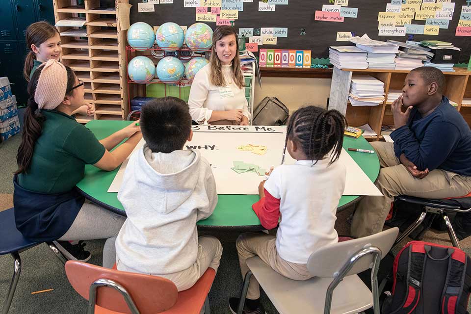 SLU student teaching younger students SLU student teaching younger students