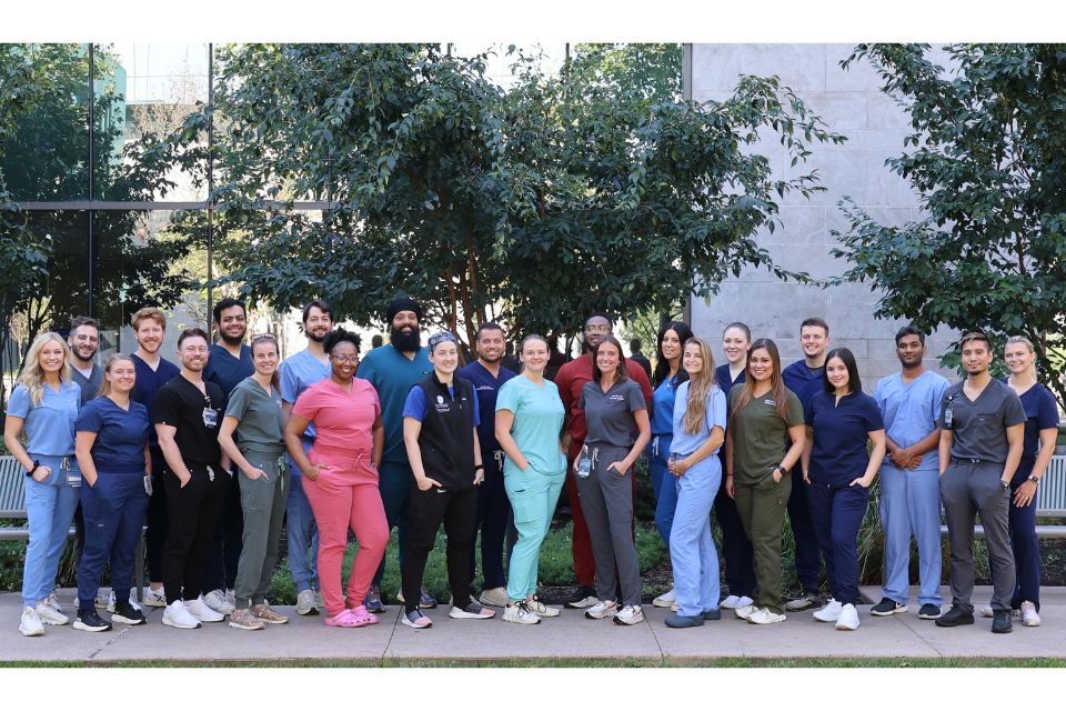 Group photo of emergency residents standing outside SSM Health Saint Louis University Hospital