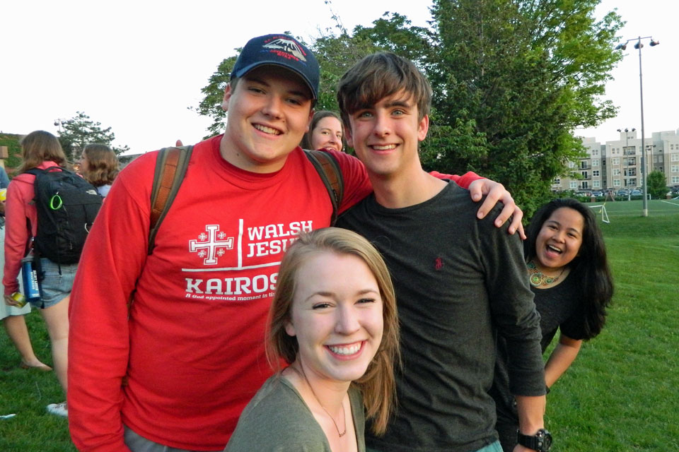 A group of Micah students smile at the camera while spending time outside.