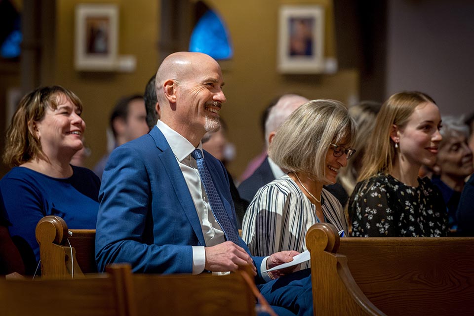 President Edward Feser, Ph.D.,  laughs during the homily at the Mass of Hope and Community on Nov. 4, 2025. Photo by Sarah Conroy..