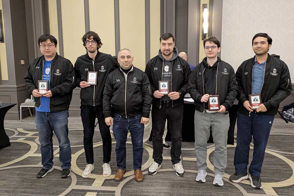 a group of men holding awards
