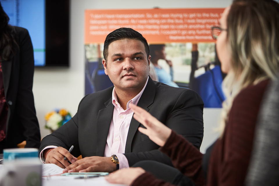 A public health student listens to a classmate.