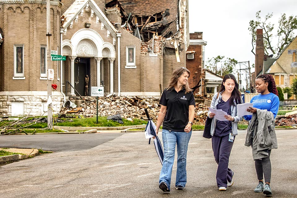 SLU faculty and staff during tornado cleanup in St. Louis SLU faculty and staff during tornado cleanup in St. Louis